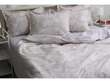 Delicate bed linen made of natural Turkish cotton. The design is made with ornate patterns of lilac color, which are located on a smoky gray canvas. Exquisitely beautiful bed linen, suitable for a gray interior, as well as in pink tones. The set is produc