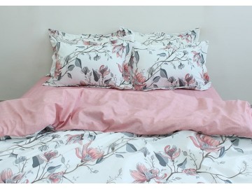 Cotton bed linen with a double-sided duvet cover in pink tones. Magnolia branches on a white background. A natural set that comes with pillowcases with a decorative zippered border, just like the duvet cover.