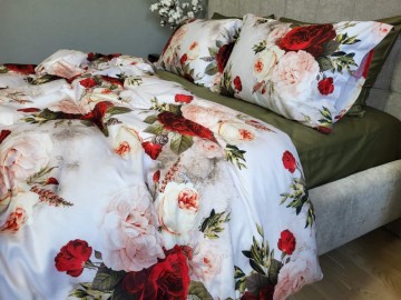 Elite bed linen made of organic mercerized satin will not leave indifferent any connoisseur of luxurious home textiles. Rich dark red bouquets of roses on the duvet cover in combination with olive color.