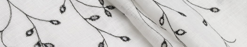 White linen in black embroidery